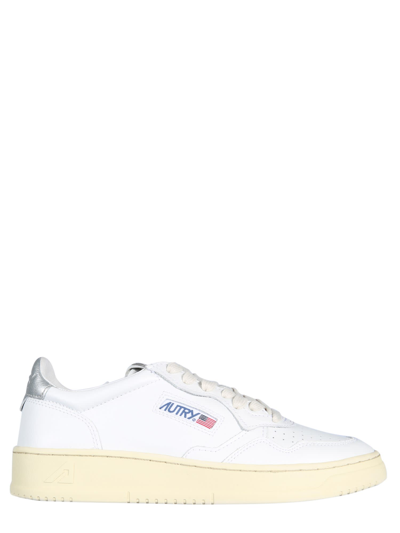 Shop Autry Leather Sneakers In White