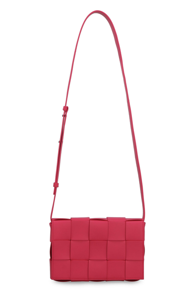 Shop Bottega Veneta Cassette Leather Crossbody Bag In Red