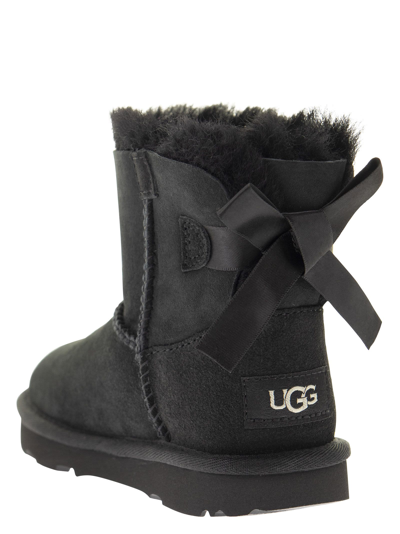 Shop Ugg Mini Bailey Bow Ii - Ankle Boot In Black