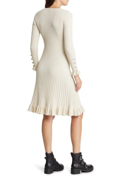 Shop Area Stars Ruffle Trim Ribbed Long Sleeve Cotton Sweater Dress In Ivory