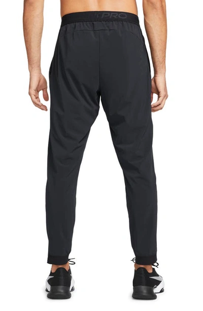Shop Nike Dri-fit Vent Max Pants In Black/ Black/ White