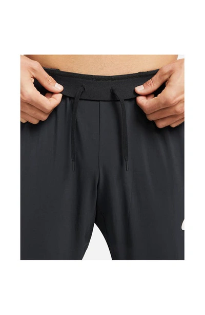Shop Nike Dri-fit Vent Max Pants In Black/ Black/ White