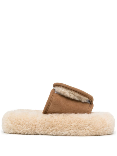 Shop Natasha Zinko Touch-strap Shearling Slides In Brown