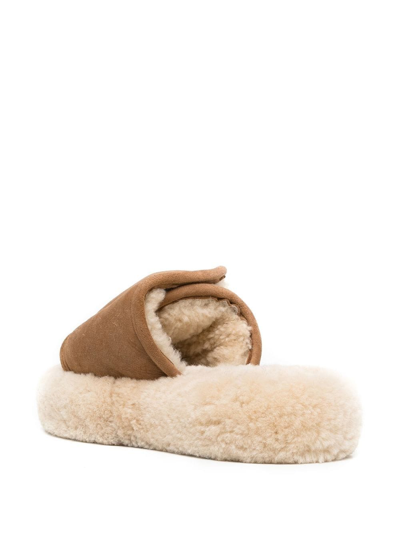 Shop Natasha Zinko Touch-strap Shearling Slides In Brown