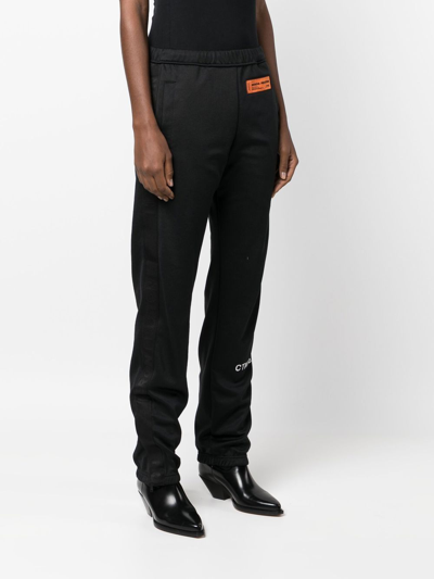Heron Preston Logo Patch Ruched-ankle Trousers In Schwarz