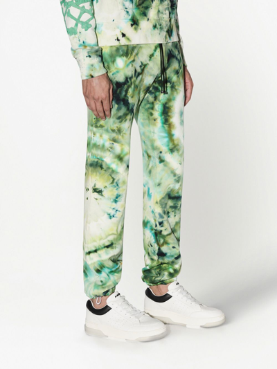 Shop Amiri Tie-dye Organic Cotton Track Pants In Green