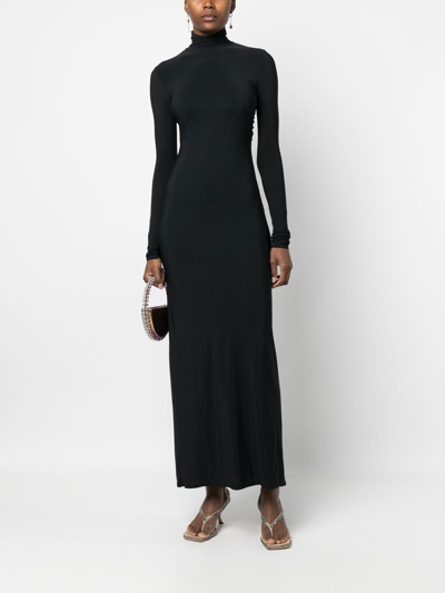 Shop Amazuìn Backless Long-sleeved Maxi Dress In Schwarz