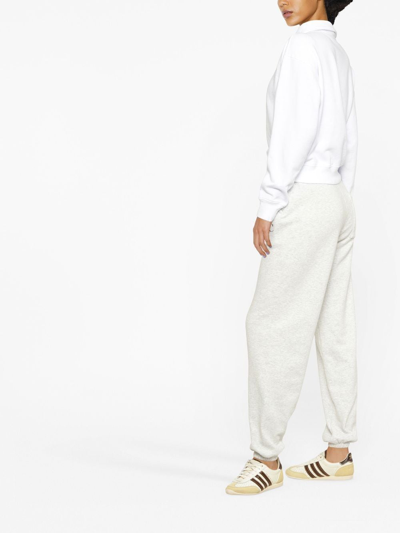 Sporty And Rich Logo-print Long-sleeved Polo Top In Weiss