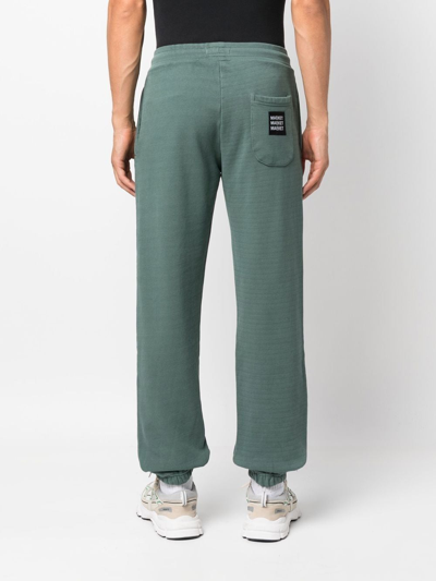 Shop Market Logo-patch Washed Track Pants In Grün