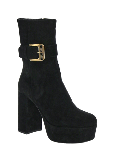 Shop Miu Miu Black Wedge Ankle Boots In Nero
