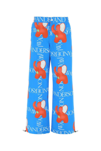 Shop Jw Anderson Graphic Printed Wide Leg Trousers In Blue