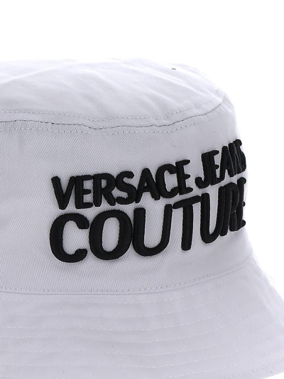 Shop Versace Jeans Couture Embroidered Bucket Hat In White/black