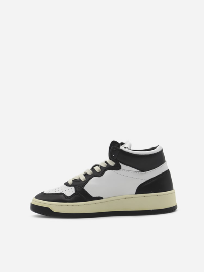 Shop Autry Two-tone Low-top Sneakers In Leather In White Black