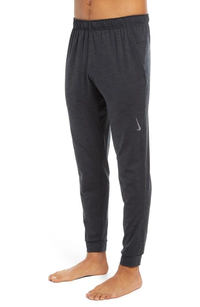 Shop Nike Pocket Yoga Pants In Off Noir/ Black/ Gray
