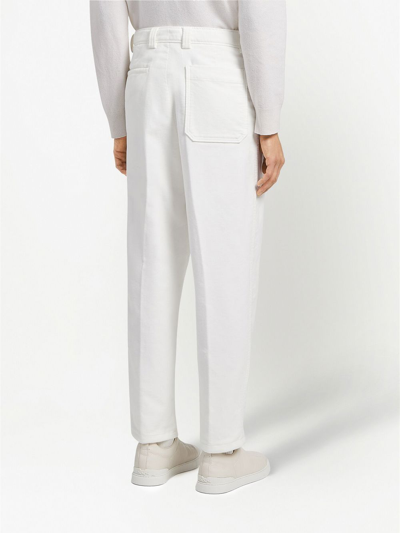 Shop Zegna Pleat-detail Tapered Jeans In White