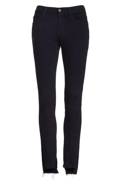 Shop Frame Le Skinny De Jeanne Raw Stagger Hem Jeans In Film Noir