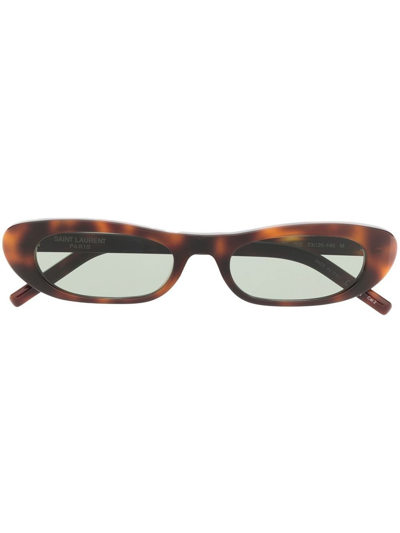 Shop Saint Laurent Sl 557 Oval Sunglasses In Brown