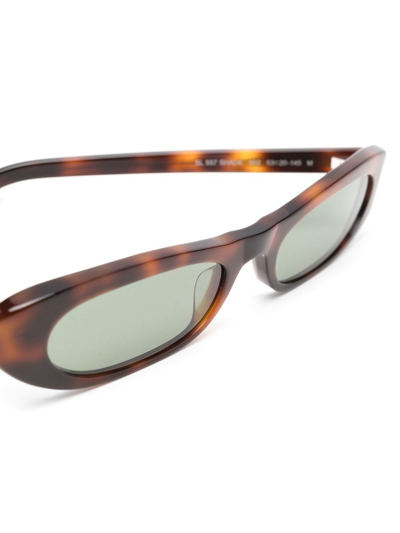 Shop Saint Laurent Sl 557 Oval Sunglasses In Brown