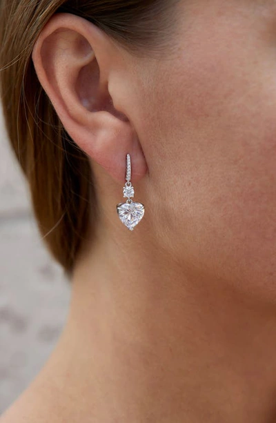 Savvy Cie Jewels Rhodium Plated Sterling Silver Canary Cz Heart Drop Huggie Earrings In White
