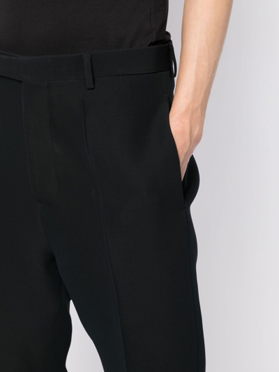 Shop Rick Owens Pleated Tapered-leg Trousers In Blue