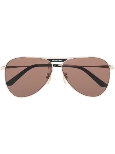 Shop Balenciaga Pilot-frame Tinted Sunglasses In Gold