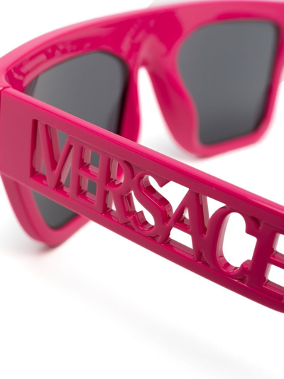 Shop Versace Logo-arm Detail Sunglasses In Pink