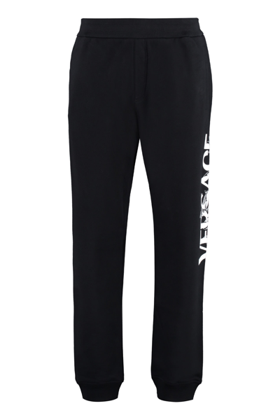 Shop Versace Logo Detail Cotton Track-pants In Black