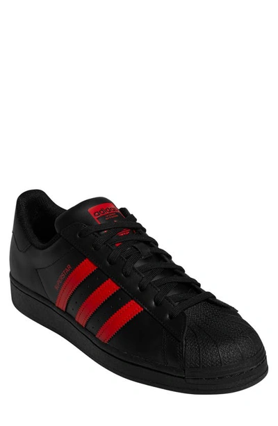 Shop Adidas Originals Superstar Sneaker In Black/ Red