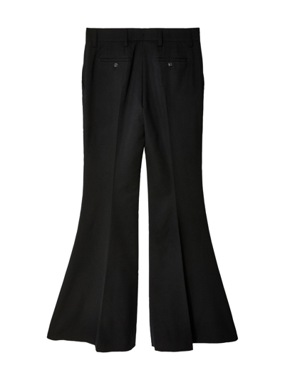 Shop Prada Flared Wool Trousers In Black