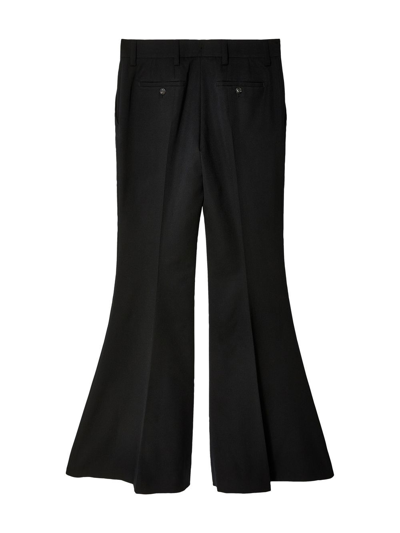 Prada Flared Wool Trousers In Black