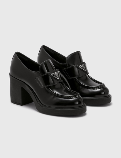 Shop Prada Chocolate High-heeled Brushed Leather Loafers In Black
