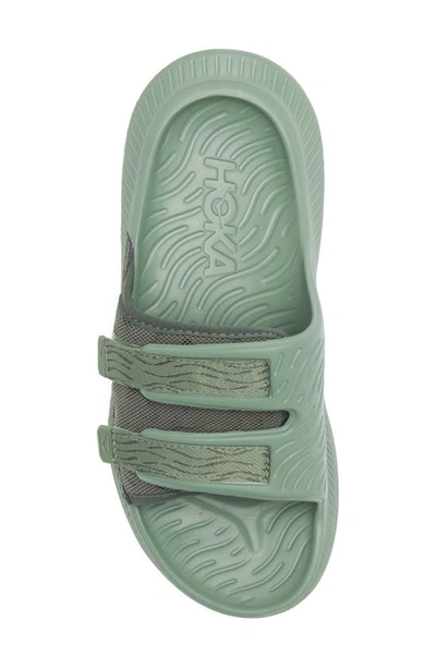 Shop Hoka Gender Inclusive Ora Luxe Slide Sandal In Thyme / Loden Frost