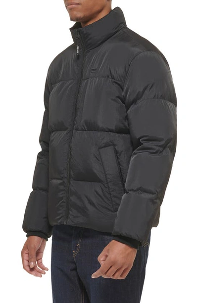 Shop Dockers Levi's Stand Collar Puffer Jacket In Black