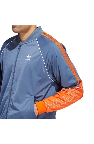 Adidas Originals Sst Tricot Track Jacket In Wonder Steel/ Orange/ White |  ModeSens