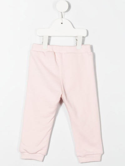 Shop Balmain Embossed-button Trousers In Pink