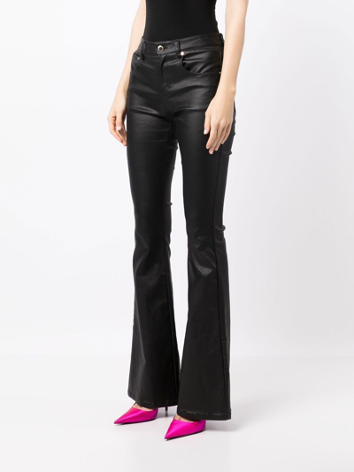 Shop Retroféte Laurel Coated Flared Trousers In Black