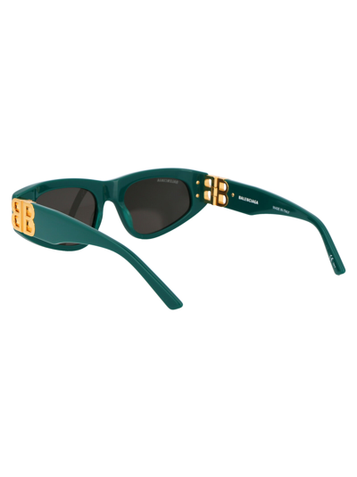Shop Balenciaga Sunglasses In 005 Green Gold Grey