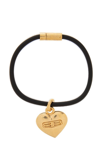 Shop Balenciaga Debossed Logo Heart Bracelet In Gold