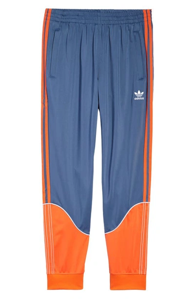 Adidas Originals Sst Tricot Track Pants In Blue/orange | ModeSens