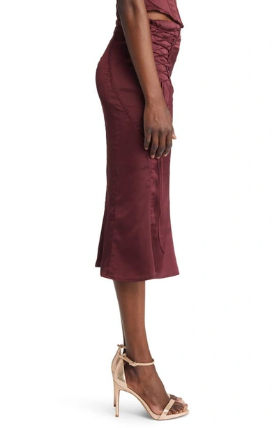 Shop House Of Cb Sidonie Lace-up Satin Trumpet Midi Skirt In Wine