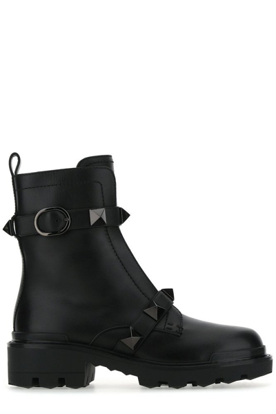Shop Valentino Garavani Roman Stud Almond Toe Combat Boots In Black