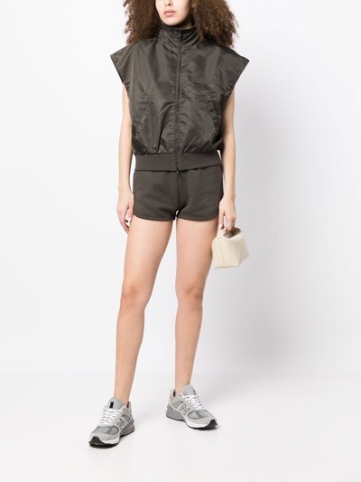 Shop Essentials Debossed-logo Zipped Vest In Brown