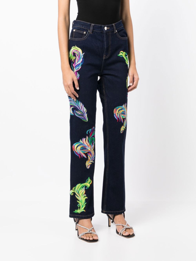 Shop Area Embroidered Feather Back-slit Jeans In Blue