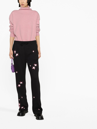 Shop Red Valentino Star-print Trousers In Black