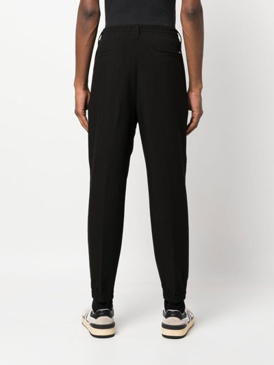 Shop Emporio Armani Elasticated Straight-leg Trousers In Black