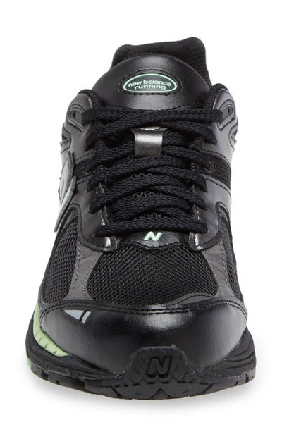 Shop New Balance 2002r Sneaker In Black Green