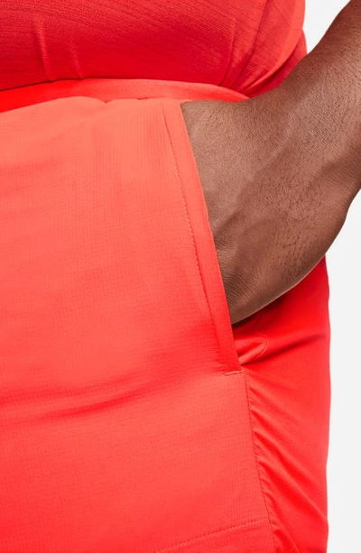 Shop Nike Dri-fit Stride Unlined Running Shorts In Bright Crimson/black