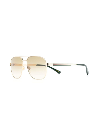 Shop Gucci Logo-engrave Pilot-frame Sunglasses In Gold