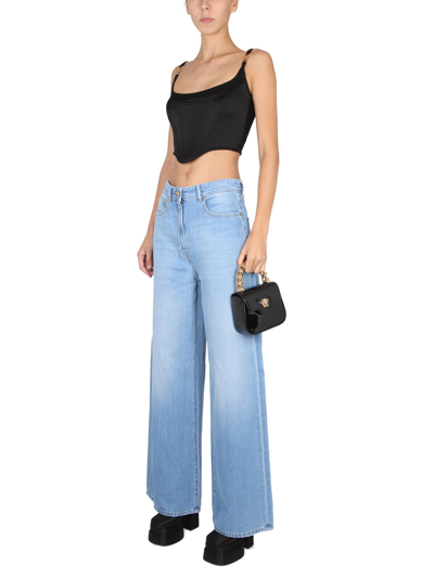 Shop Versace Medusa Wide Leg Jeans In Blu