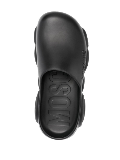 Shop Moschino Round-toe Chunky-sole Slides In 黑色